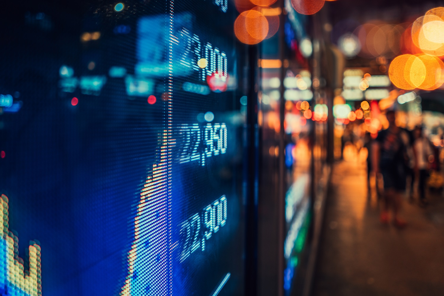 Digital,Stock,Market,Display,In,An,Urban,Setting,At,Twilight